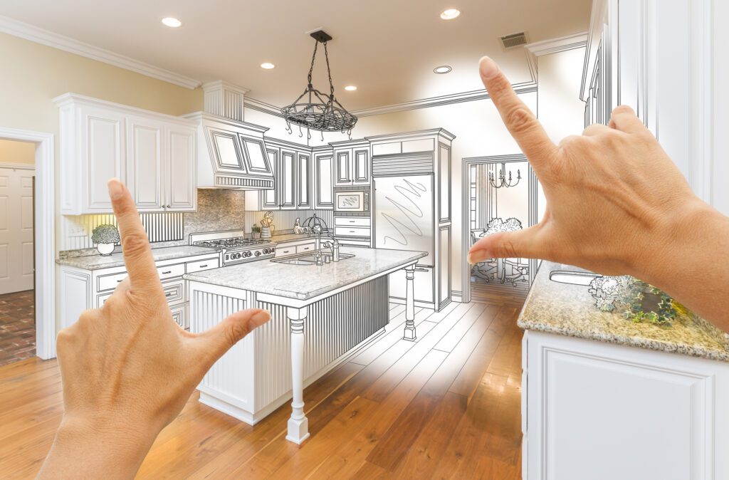 Female Hands Framing Custom Kitchen Design Drawing and Photo